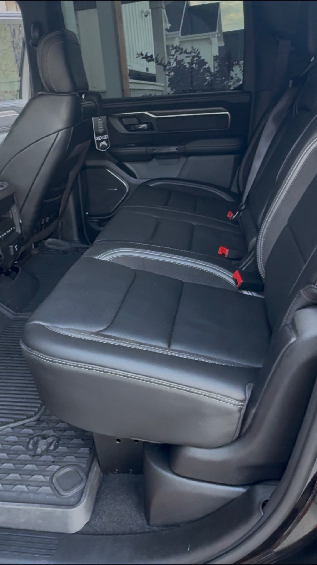 Clean black pickup truck rear seat after mobile detailing